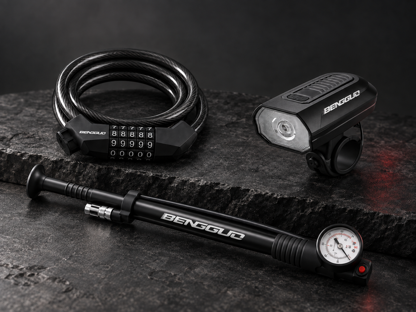 BENGGUO cable lock, light and horn, and bicycle pump in a dark studio